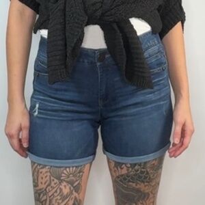 Democracy denim shorts in size 6 featuring the signature “A